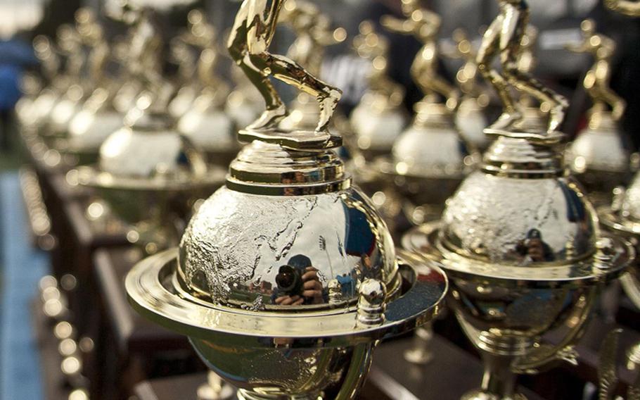 Championship hardware is on display prior to Saturday's Army-Navy flag football game at Sims Field, Seoul American High School, South Korea. Army prevailed over Navy 12-6 in overtime.