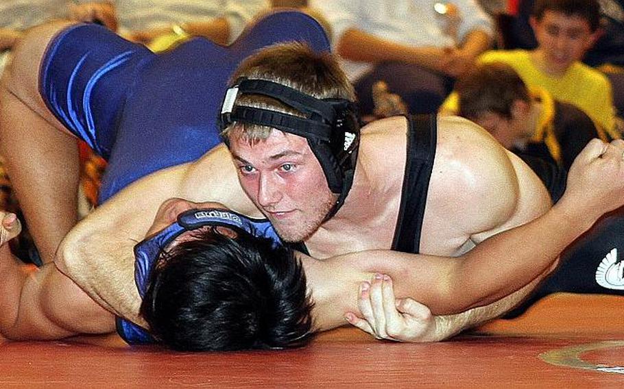 Two-time Far East tournament weight-class gold-medalist Michael Spencer, top, of Zama American.