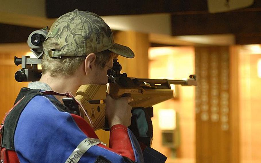 Heidelberg junior Nathan Johnson takes aim at the targets in the standing position at Saturday's high school marksmanship match at Heidelberg High School.