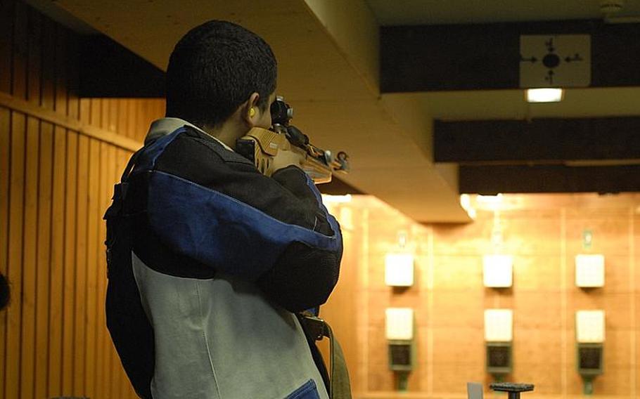 Mannheim freshman Carlos Torres fires at the targets in the standing position at Saturday's high school marksmanship match at Heidelberg High School.  Mannheim finished third to Patch and Heidelberg in the compeitition.