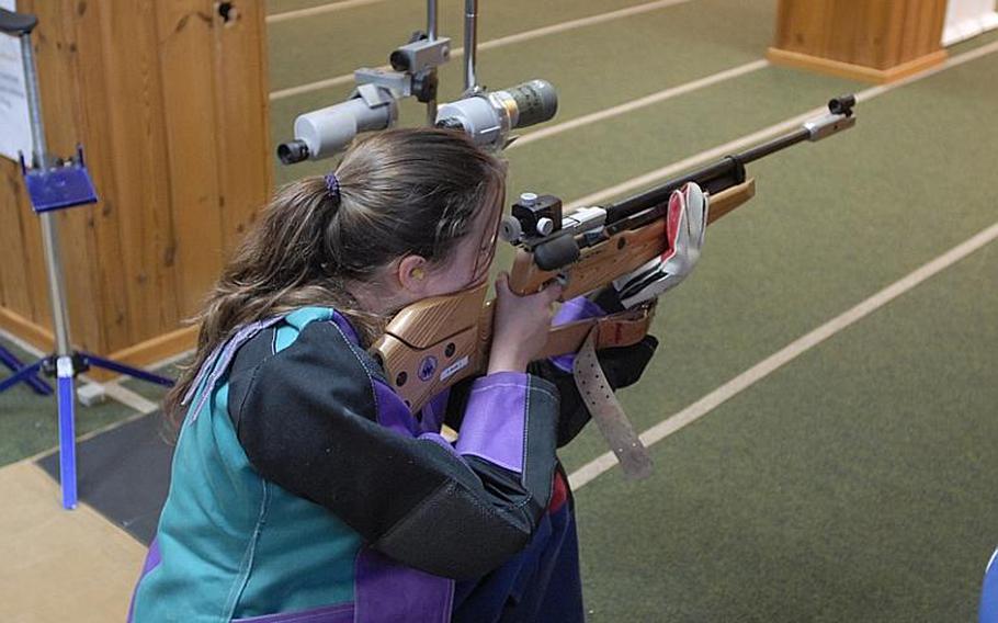 Heidelberg senior Katelyn Bronell takes aim at the targets in the standing position at Saturday's high school marksmanship match at Heidelberg High School. She finished fourth in individual scoring.