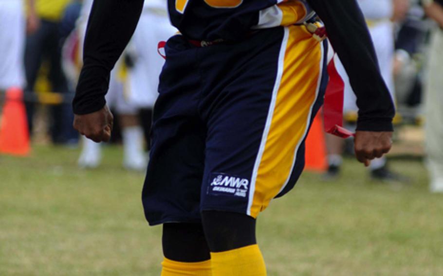 Navy's Tyron Francis exults after scoring a two-point conversion during Saturday's Army-Navy flag football game at Torii Field, Torii Station, Okinawa. Navy broke a six-year losing streak in the 21-year-old series, beating Army, 27-3.