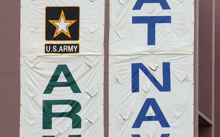A huge ''Go Army Beat Navy'' sign is draped over the south wall of the Torii Station fitness and sports center during Saturday's Army-Navy flag football game at Torii Field, Torii Station, Okinawa. Navy broke a six-year losing streak in the 21-year-old series, beating Army, 27-3.