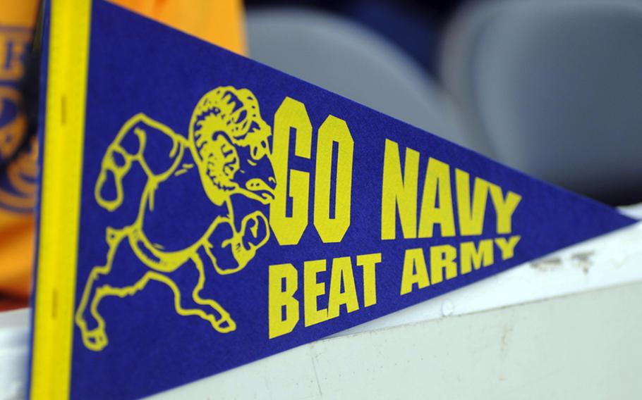 A ''Go Navy, Beat Army'' pennant is on display at Navy's VIP section during Saturday's Army-Navy flag football game at Torii Field, Torii Station, Okinawa. Navy broke a six-year losing streak in the 21-year-old series, beating Army, 27-3.