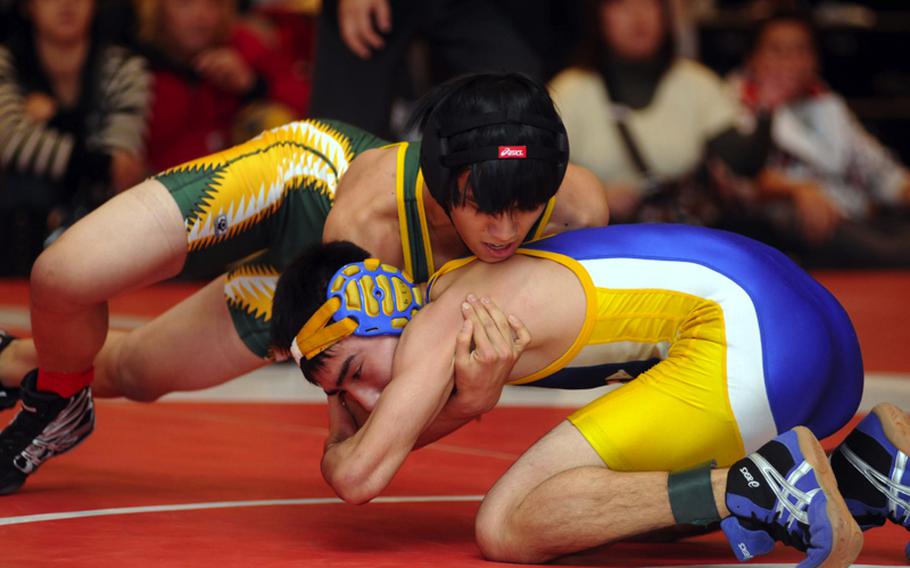 Cameron Namocot of Robert D. Edgren gets the upper hand on Kai Novelli of Yokota during Saturday's 122-pound final in the Nile C. Kinnick Invitational "Beast of the Far East" Wrestling Tournament in Japan. Namocot pinned Novell in 3 minutes, 13 seconds.