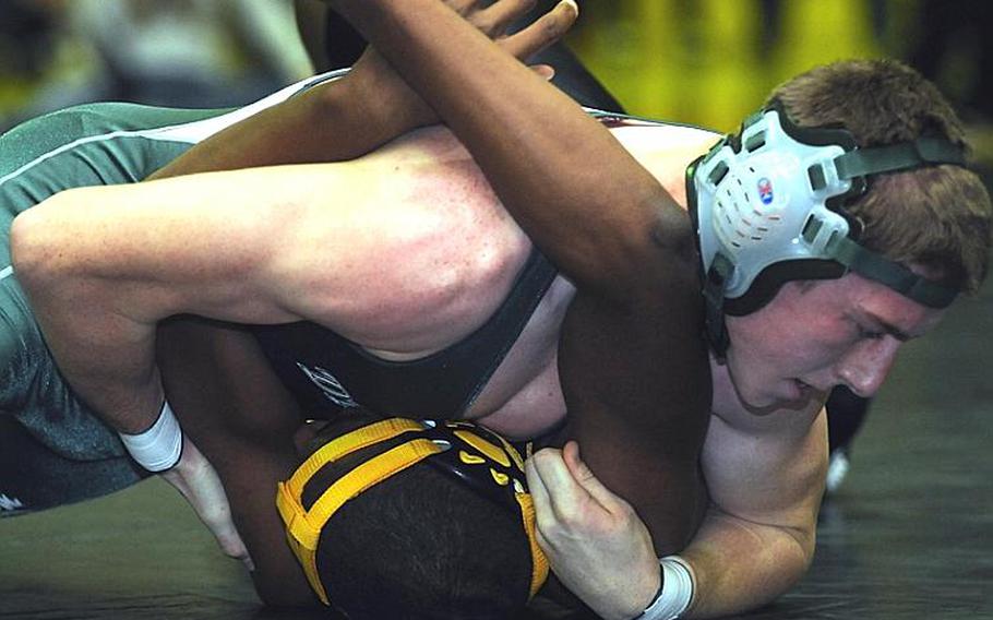 Kubasaki's Matt Payne glues Kadena's Daejon Street's shoulders to the mat during Thursday's 180-pound bout in the Okinawa Activities Council dual meet at Kadena High School, Okinawa. Payne pinned Street in 29 seconds and Kubasaki won the dual meet, 36-28.