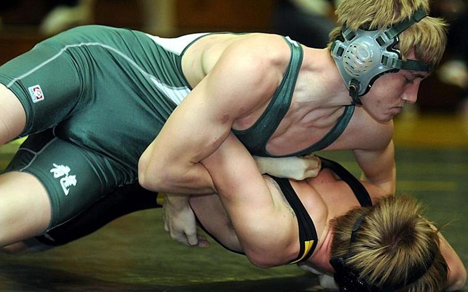 Kubasaki's Jon Goddard gets the upper hand on Kadena's NIcholas Veit during Thursday's 141-pound bout in the Okinawa Activities Council dual meet at Kadena High School, Okinawa. Goddard pinned Veit in 55 seconds and Kubasaki won the dual meet, 36-28.