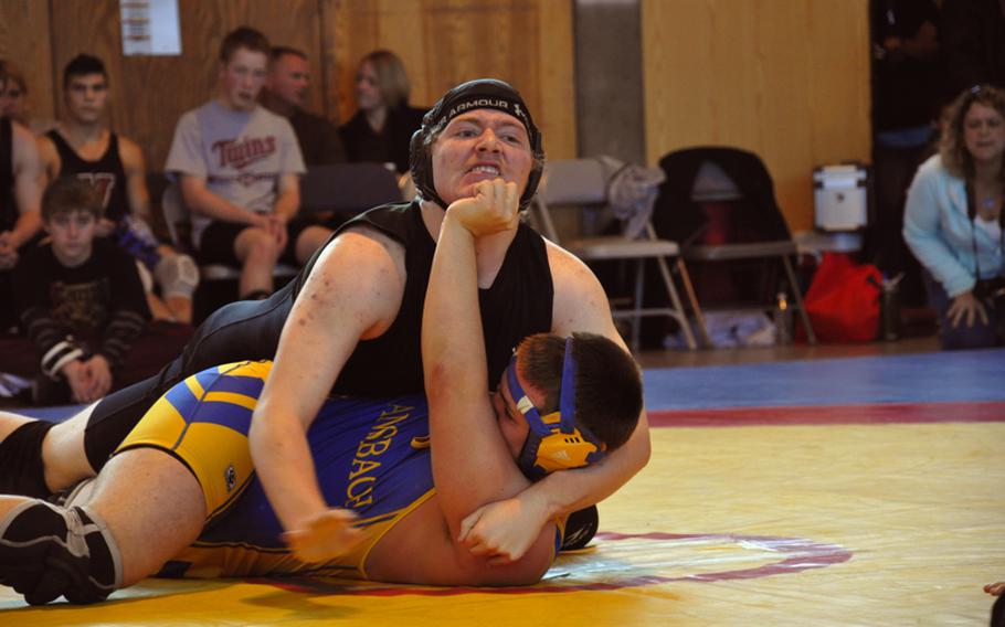 Ansbach's T.J. Propp, bottom,  tries to hold off Hohenfels' John Aber Saturday during a 215-pound match. Propp won the match by pinning Aber.