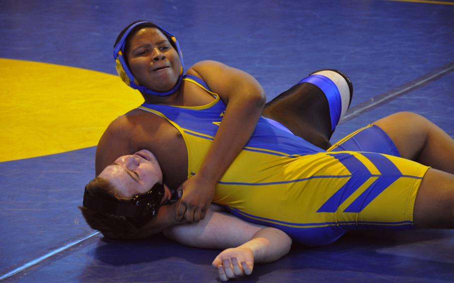 Ansbach freshman Idar Sumpter attempts to pin Hohenfels sophomore Brandon Reed Saturday in Ansbach. Sumpter won the match by a fall in the 285-pound weight class.