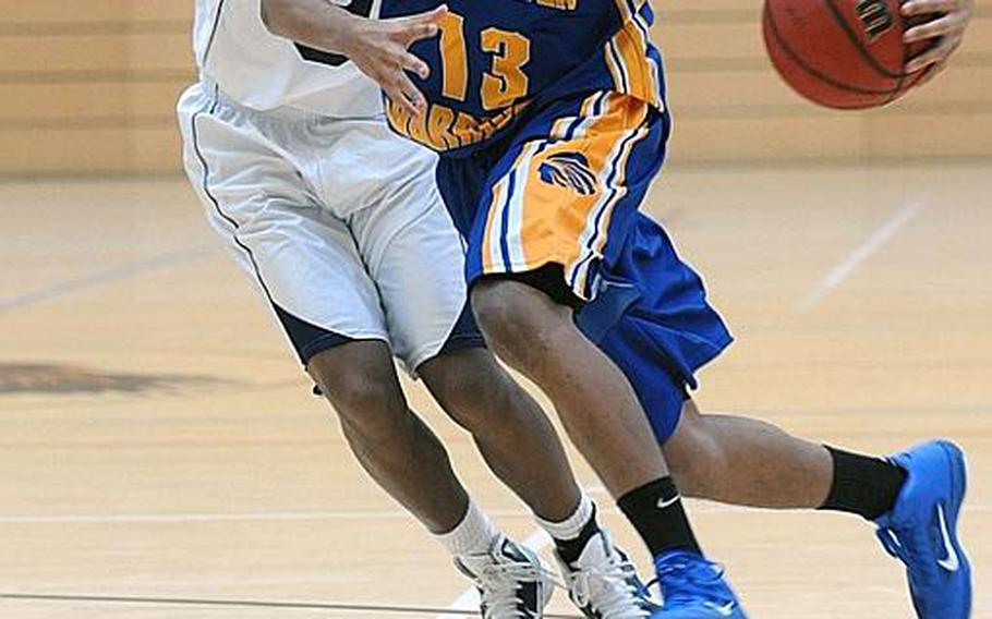 Wiesbaden's Victor Strange, left, drives toward the basket as  Bitburg's Derrick Bland tries to defend. Wiesbaden won at home, 62-45.