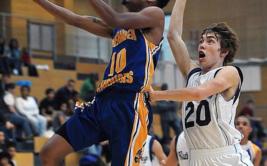 Wiesbaden's Antonio Trawick goes to the hoop past Bitburg's Matt Flood. Trawick had 10 points in the Warriors' 62-45 home victory Saturday.