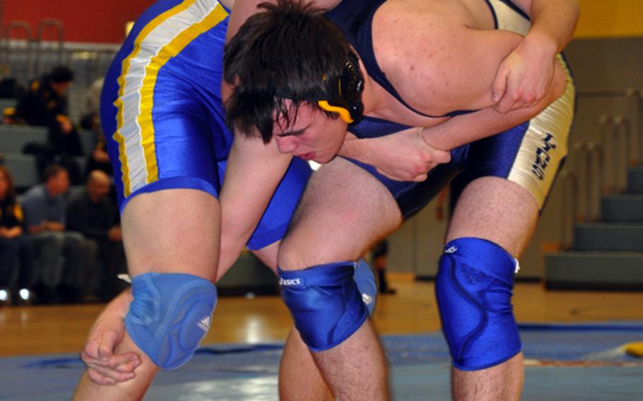 William Heiges, left, of Wiesbaden, tries to get control of Jonathan Brown of Heidelberg during a 215-pound match Saturday at the Bamberg Freedom Fitness Facility. Heiges went on to win the match, 13-10.
