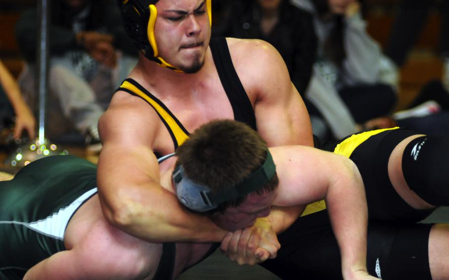 Kadena's Aaron Ahner, top, readies a head-whip throw on Kubasaki's Jacob Wood during Saturday's 215-pound championship bout in the 4th Rumble on the Rock Wrestling Tournament at Kubasaki High School, Okinawa. Ahner won by pin in 5 minutes, 23 seconds and Kadena won its third straight individual freestyle team title.