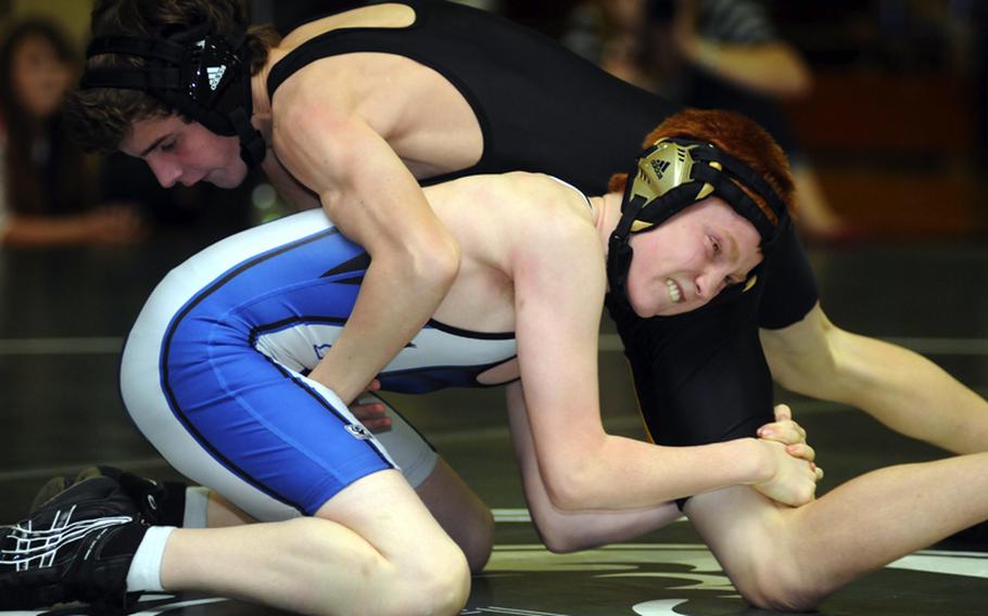 Kadena's Thomas Cioppa, top, gains the upper hand on Seoul American's Devin Furner during Saturday's 108-pound championship bout in the 4th Rumble on the Rock Wrestling Tournament at  Kubasaki High School, Okinawa. Cioppa twice pinned Furner, in 1 minute, 34 seconds and 3 minutes, 5 seconds to rally out of the knockout bracket for the gold medal and Kadena won its third straight individual freestyle team title.