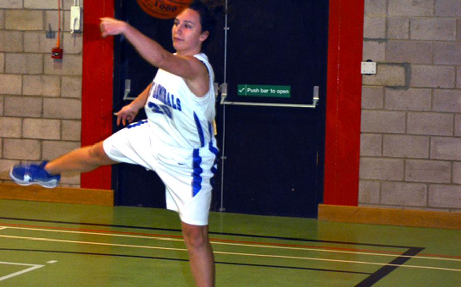 Rota's Thais Gartland saves the ball from going out of bounds during a game Friday against Brussels, won by Rota 30-12. The game was part of a series of games between four Division III teams at RAF Alconbury from Thursday through Saturday.