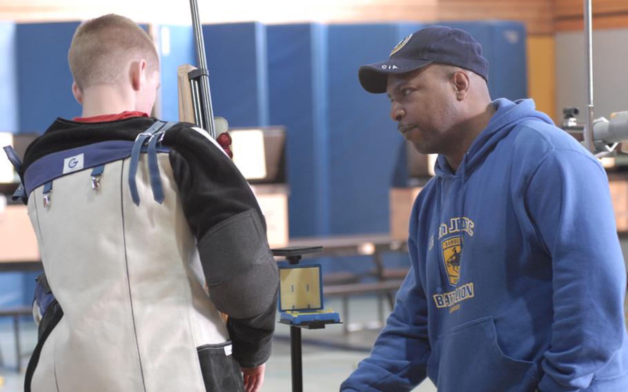 Bamberg coach Prince Young gives advice to Bamberg sophomore shooter Allan Dow before the second firing group started Saturday at the 2011 DODDS-Europe marksmanship championships at Baumholder, Germany.