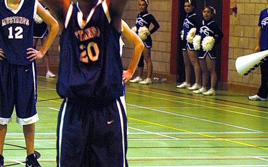 Menwith Hill junior Chris Jackson shoots a free throw during a game against Rota last weekend. Jackson is averaging around 15 points a game for the Mustangs.