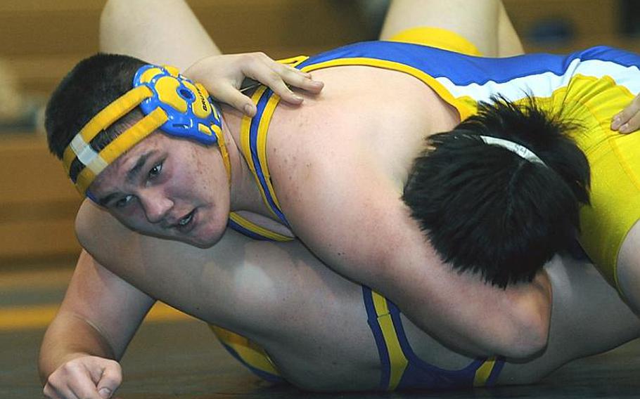 Jake Jackson of Yokota puts the finishing touches on a pinfall victory over Kevin Miller of St. Mary's International during Wednesday's 215-pound bout in the Kanto Plain Association of Secondary Schools' regular-season finale at St. Mary's International School, Tokyo. Jackson pinned Miller in 3 minutes, 2 seconds, but St. Mary's beat Yokota, 38-25, to force a three-way tie atop the Kanto final regular-season standings with Zama American at 4-1.