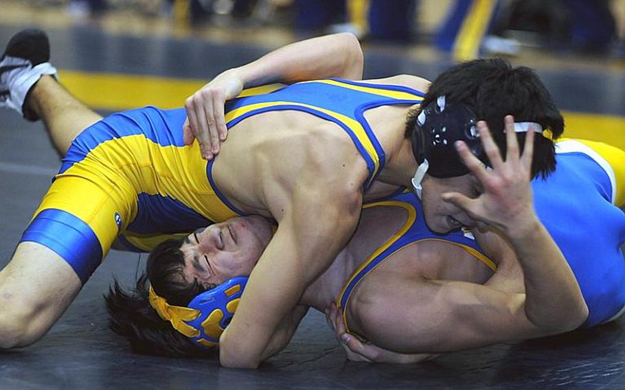 Soma Yoshida of St. Mary's International gets the upper hand on Yokota's Phil Robles during Wednesday's 115-pound bout in the Kanto Plain Association of Secondary Schools' regular-season finale at St. Mary's International School, Tokyo. Yoshida pinned Robles in 3 minutes, 2 seconds and St. Mary's beat Yokota, 38-25, to force a three-way tie atop the Kanto final regular-season standings with Zama American at 4-1.
