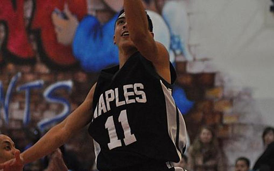 Naples point guard Jun Jun Gallardo goes up for a layup after a steal Friday night against Aviano. The Wildcats stayed perfect on the season at 11-0 by downing the two-time defending European Division II champions, 42-28.