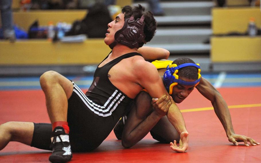Bamberg's Tiawan Fauntleroy, right, and Vilseck's Tyler Cepeda  wrestle in their 119-pound match during a four-team comeptition in Heidelberg on Saturday. Fauntleroy won.
