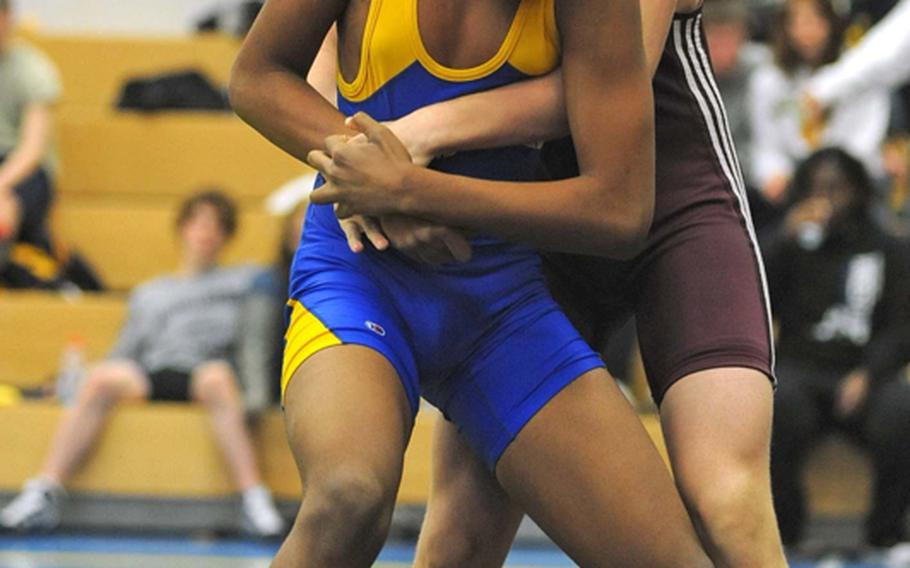 Vilseck's Andrew Mineni, right, tries to lift Bamberg's Travis Reynolds in a 171-pound match in Heidelberg on Saturday. Mineni went on to win.