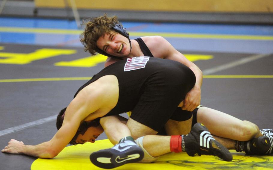 Andrew Baxter of Heidelberg, top, won his 135-pound match against Vilseck's Scott Hammel during a four-team competition in Heidelberg on Saturday.