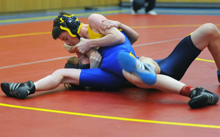 Bamberg's Ryan Buettner, top, puts the pressure on Heidelberg's Nick Baxter in their 112-pound match in Heidelberg, Germany, on Saturday. Buettner, a freshman, won to improve to 19-0 on the season.