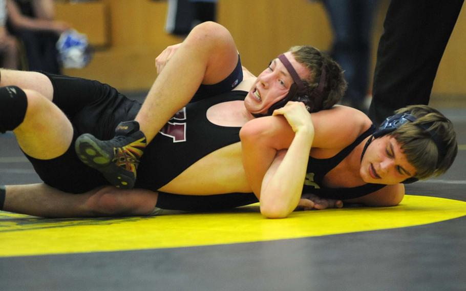 Vilseck's Chris Nelson, left, tries to get out of the grasp of Heidelberg's Justin Vatcher in a 152-pound match during a four-team competition in  Heidelberg on Saturday. Vatcher prevailed.
