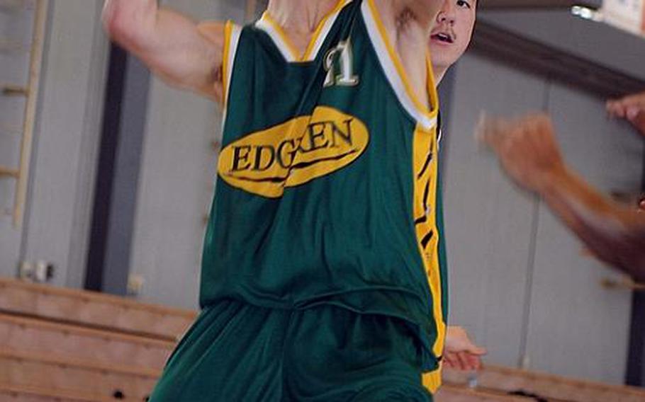 Robert D. Edgren Eagles senior captain Jacob Sterry, with ball, says in the team's "no-star system," each player takes turns being the go-to guy and to beat them, "they have to shut all of us down."