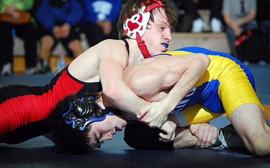 Two-time Far East champion Marcus Boehler of Nile C. Kinnick gets the upper hand on Kelly Langley of St. Mary's International during the 122-pound championship bout in the 38th Kanto Plain Association of Secondary Schools Wrestling Tournament at Yokota High School, Japan, earlier this season.