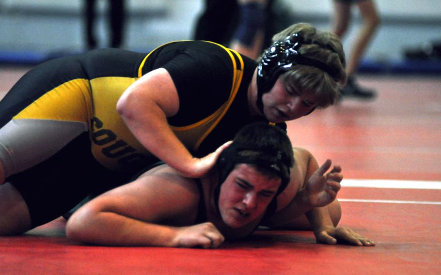 Vicenza's Jacob Lieb puts pressure on the head of  Naples' Richard Boles in a 215-pound match Saturday at the DODDS-Europe Southern Region wrestling tournament at Aviano Air Base, Italy. Lieb, a freshman, earned a 4-1 decision.