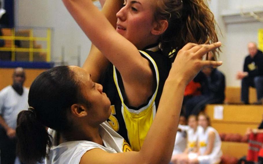 Heidelberg's Star Jones, left, defends against Patch's Alanya Lubner in a Region III game at Heidelberg on Saturday. Patch won, 56-39.