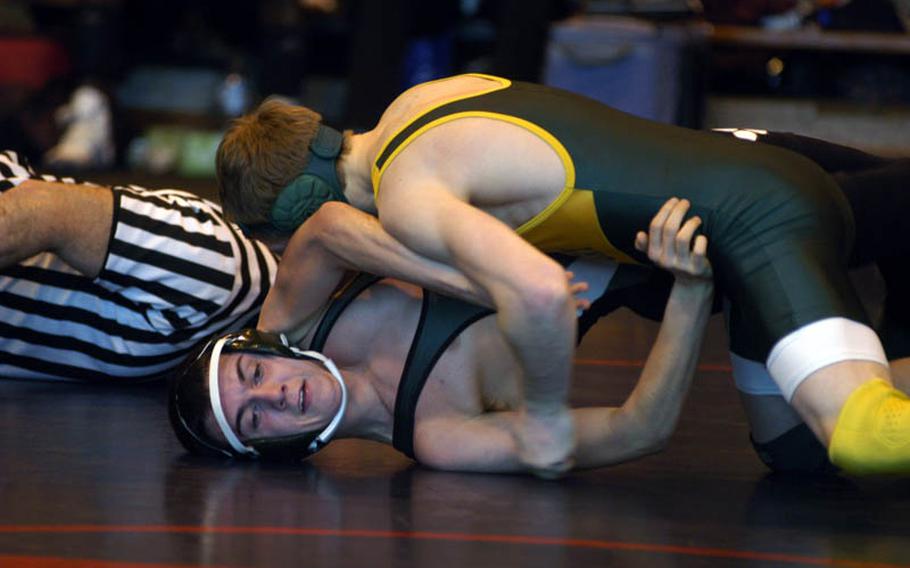 AFNORTH's Nick Friese tries to avoid a pin by Alconbury wrestler Peter Rydzynski at the DODDS-Europe Northern Sectionals at RAF Lakenheath, England.