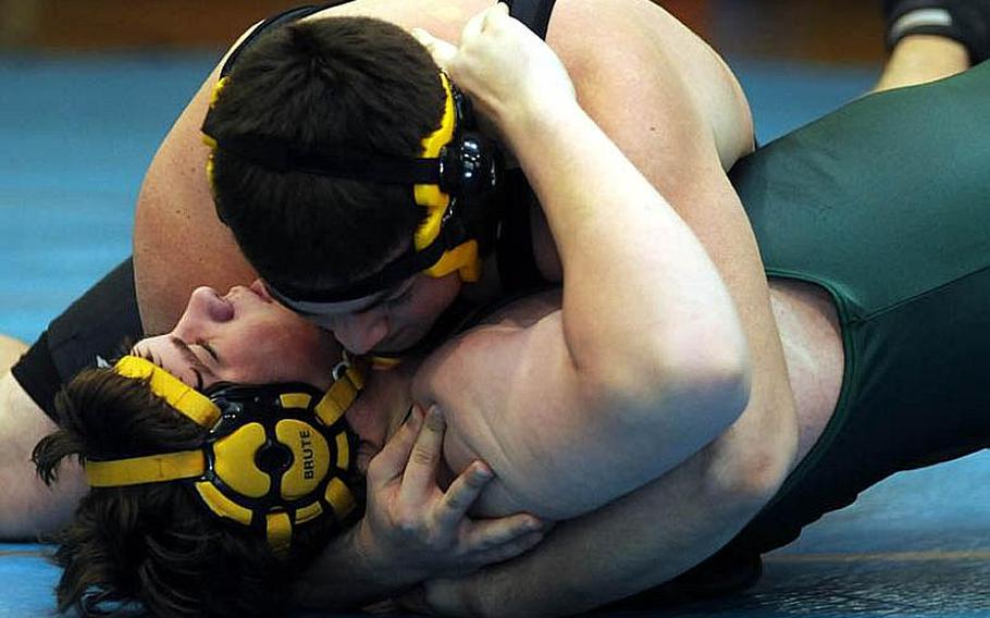 Kadena&#39;s Gabe Ahner chest-presses the shoulders of Robert D. Edgren&#39;s Jordan Cotts to the mat during Tuesday&#39;s heavyweight quarterfinal bout in the 34th Far East High School Wrestling Tournament at Super Gym, Camp Humphreys, South Korea. Ahner pinned Cotts in 1 minute, 20 seconds.