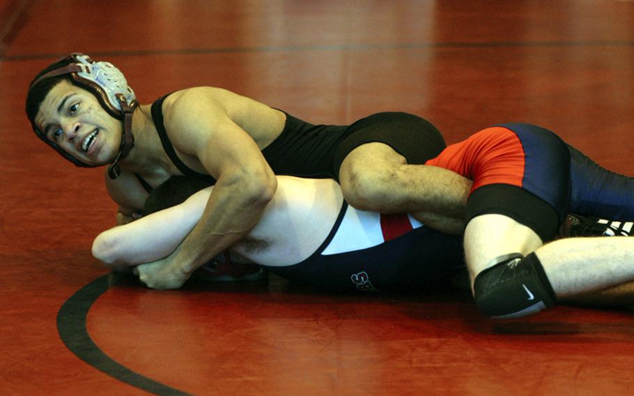 Baumholders Adrian Julien controls Lakenheath wrestler Tyler Lloyd during the final for the 119-pound weight class at the DODDS-Europe Northern Sectionals, Feb. 12. Lloyd defeated Julien for first place at the sectionals. Last season, Julien defeated Lloyd in the European championship match in the 112-pound class.