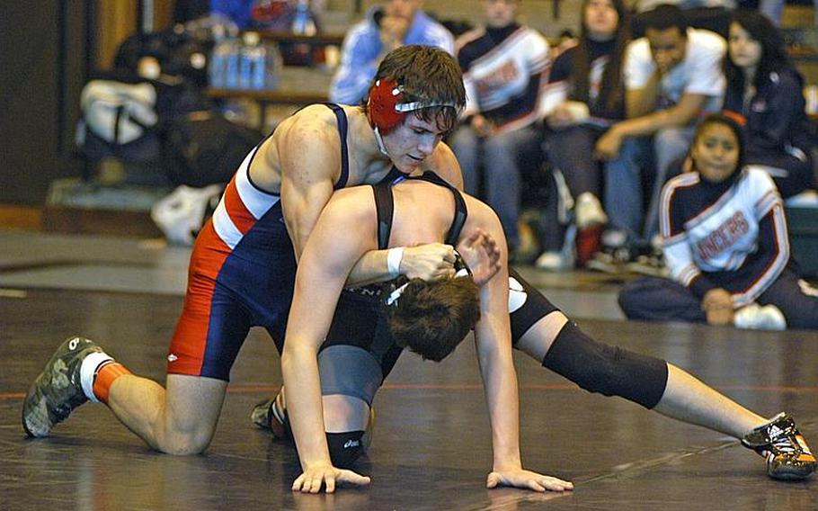 Lakenheath wrestler Adam Carroll, top, controls AFNORTH's Aldon Pagio during the DODDS Europe Northern Sectionals at RAF Lakenheath. He won the sectional when his finals opponent withdrew.