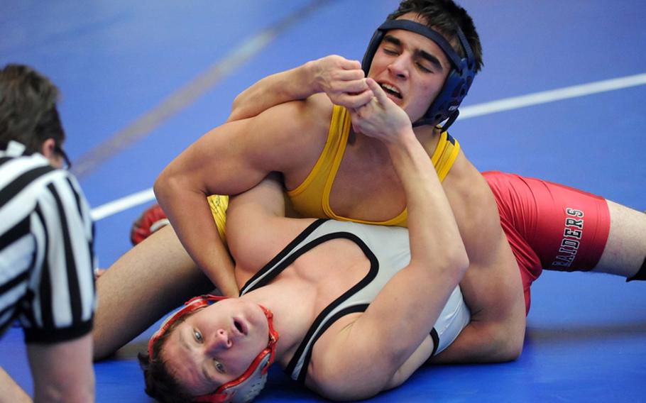 Kaiserslautern's Samuel Arnold, bottom, tries to keep Heidelberg's James McBride at bay in the 152-pound match that McBride won on the opening day of the DODDS Europe wrestling finals in Wiesbaden.