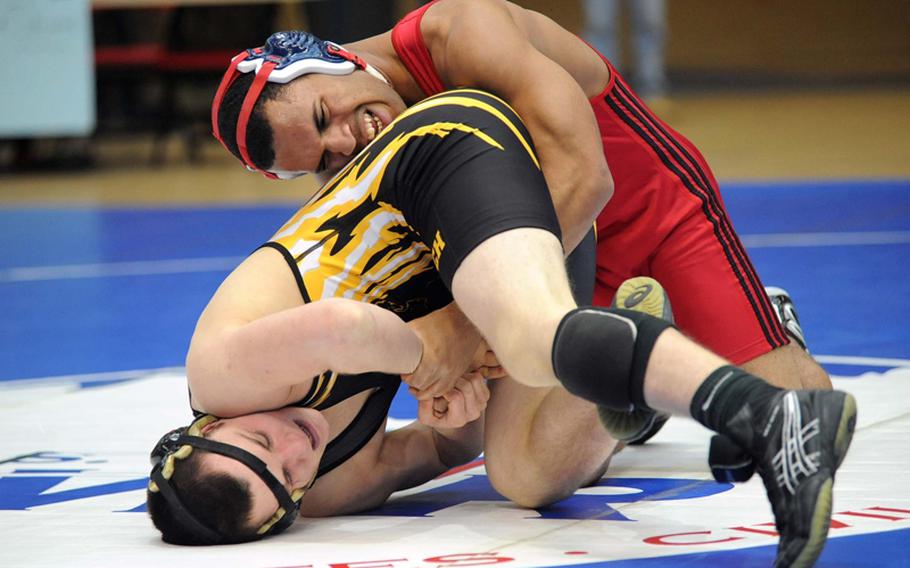 Aviano's Christopher Heath, right, grapples with Patch's Bryson Davis in a 171-pound match at the DODDS-Europe wrestling championships in Wiesbaden, on Friday. Heath won the match.