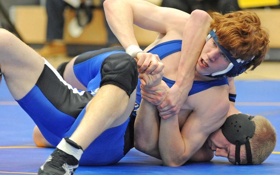 Daniel Tedesco of Brussels, top, tries to get out of the grip of Incirlik's Tyler Murphy in their 171-pound match that Murphy won during first day action at the DODDS Europe wrestling finals in Wiesbaden on Friday.