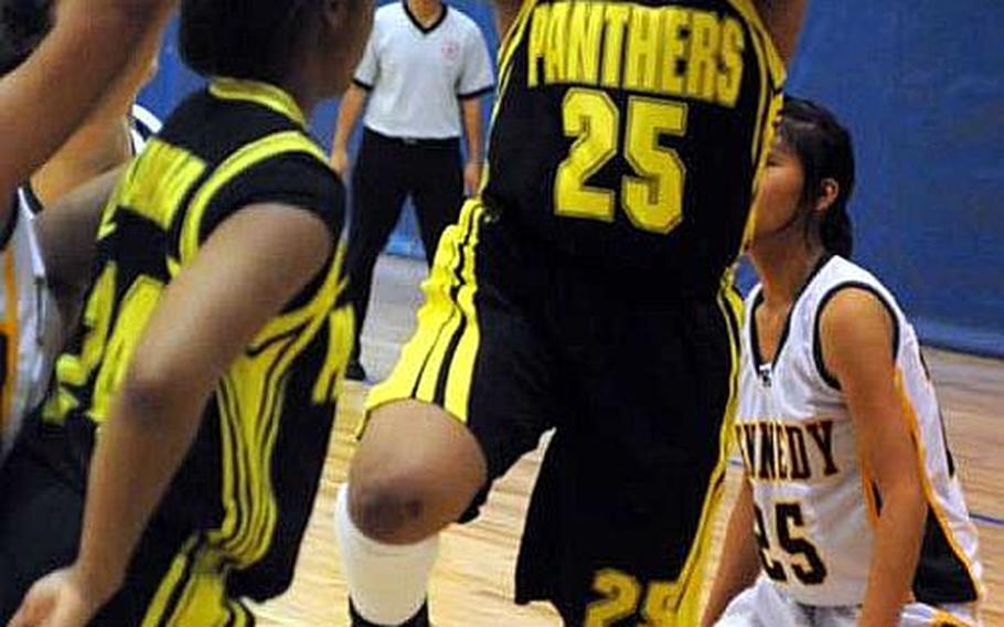 Anissa Fitz of Kadena shoots behind a screen set by teammate Mariah Harris during Tuesday&#39;s pool-play game in the Far East High School Girls Division I Basketball Tournament at Charles King Fitness & Sports Center, Naval Base Guam. Kadena won 50-20.