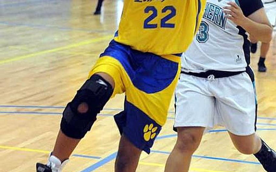 Trinity Davis of Yokota goes up for a fast-break layup ahead of Southern&#39;s Anjelica Reyes during Tuesday&#39;s pool-play game in the Far East High School Girls Division I Basketball Tournament at Charles King Fitness & Sports Center, Naval Base Guam. Yokota won 42-23.