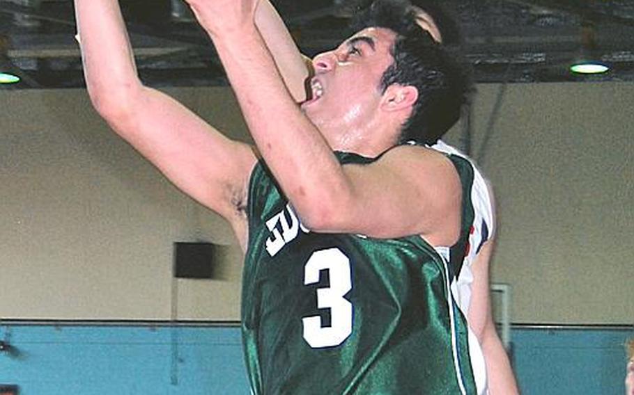 Robert D. Edgren&#39;s Mert Baysal puts up a shot against Yongsan International-Seoul during Tuesday&#39;s pool-play game in the Far East High School Boys Division II Basketball Tournament at Kelly Fitness & Sports Center, Camp Walker, South Korea. Edgren beat YIS-Seoul 54-47.