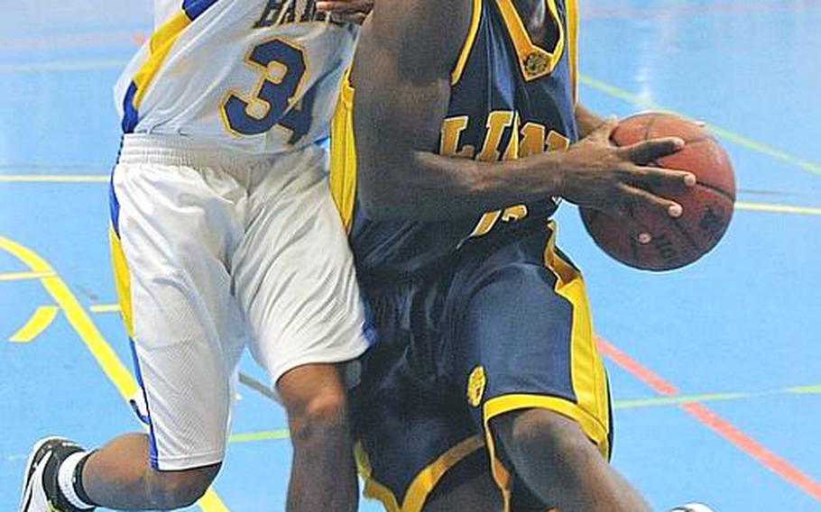 Heidelberg&#39;s Eugene Jones, right, drives around Bamberg&#39;s Ken Howard in the Lion&#39;s 67-47 victory over the visiting Barons on Jan.29. Heidelberg is 12-2 heading into this week&#39;s Division I tournament in the DODDS-Europe basketball championships in Mannheim, Germany, while the Barons (10-4) will be competing for the Division II title.