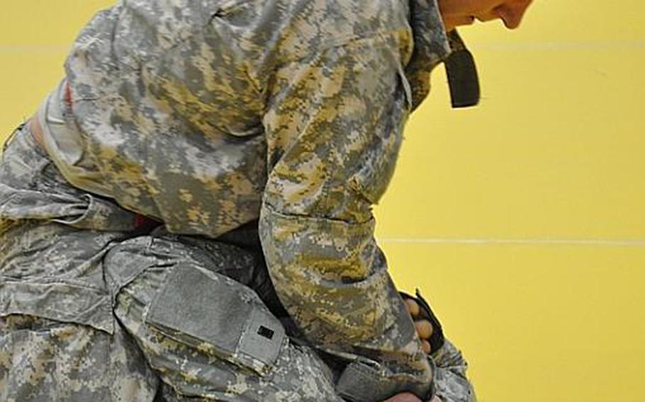 Gabriel Matt tries to choke out Erick Leon-Garcia at the second annual European Forces Combatives Championships at Bamberg, Germany, on Friday. Matt won the match to claim the most outstanding wrestler title.