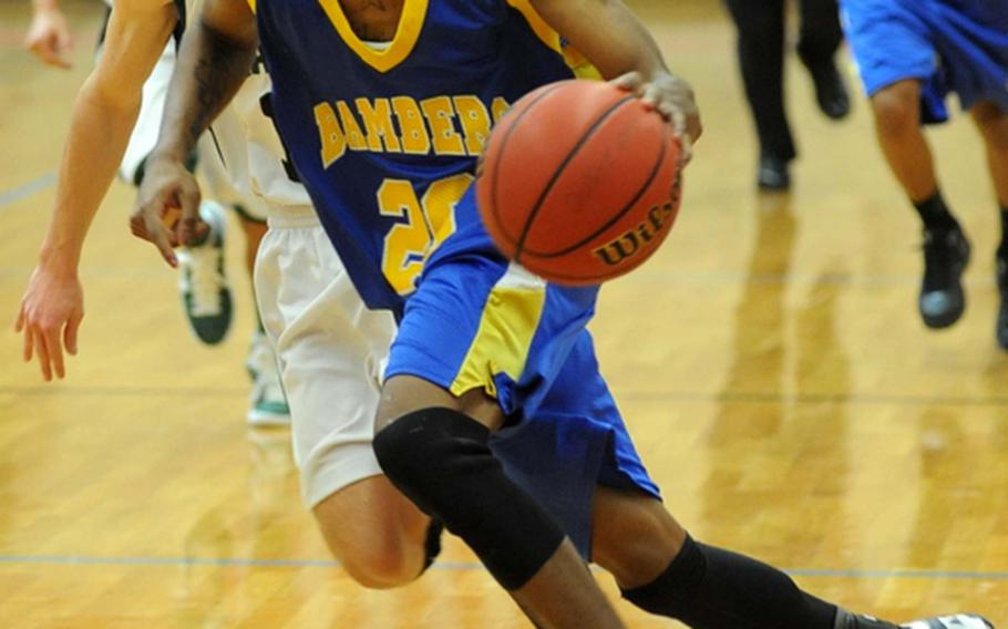 Bamberg's Quadel Webb drives to the basket, chased by Edward Allen of Naples in a semifinal game, on Friday. Bamberg won 51-44 to advance to Saturday's Division II final.