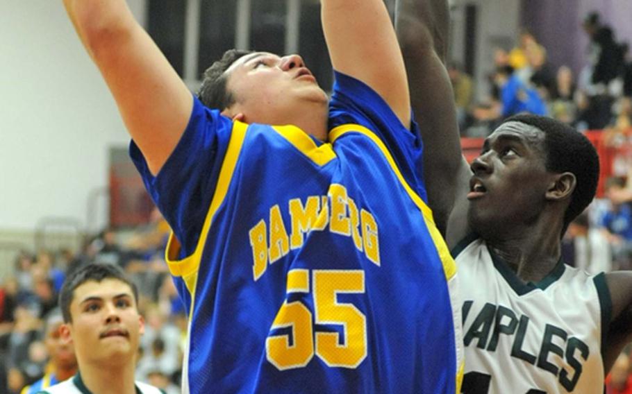 Bamberg's Erik Passi, left, goes to the basket against Nigel Alexader of Naples. Bamberg won the Division II semifinal 51-44 to advance to Saturday's championship game.