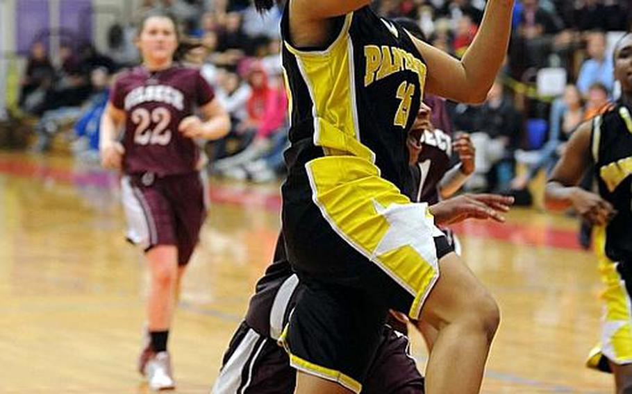 Patch's Bianca Lopez drives to the basket in the girls Division I title game against Vilseck. Patch won, 64-52