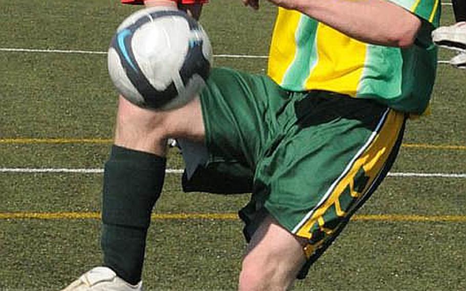 Robert D. Edgren Eagles senior Matt Linder balances the ball off his knee and prepares to fire on Nile C. Kinnick's net during Saturday's DODDS Japan season-opening match at Yokosuka Naval Base, Japan. Linder scored on the play and the Eagles won, 4-3.