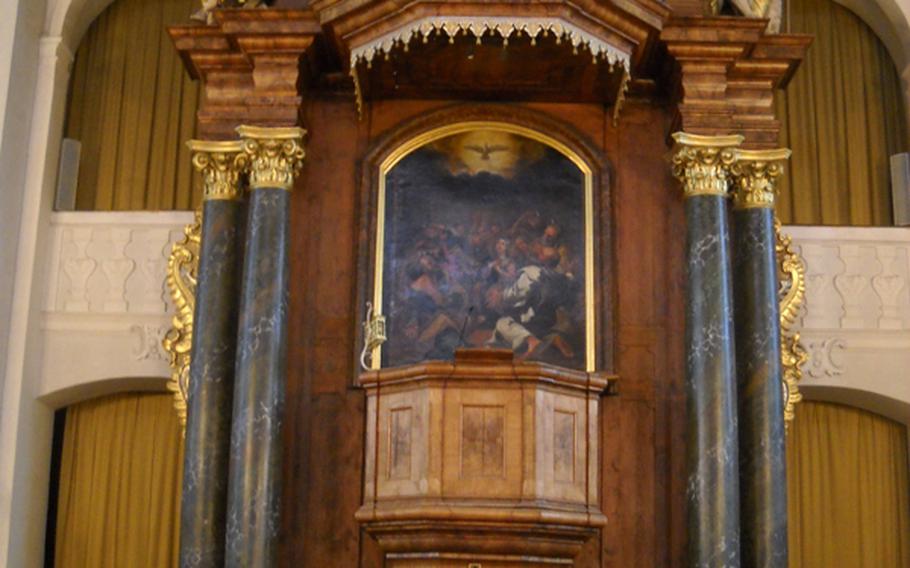 The area around the altar in St. Paul's church offers interesting detail, from a horned Moses to an hourglass, which let long-winded clergy know when it was time to bring a sermon to a close.